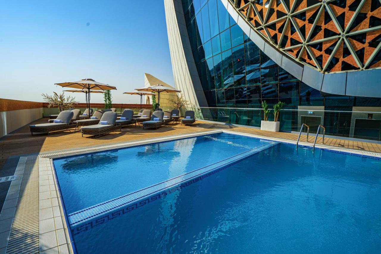 Velero Hotel Doha Lusail Экстерьер фото The swimming pool at the hotel