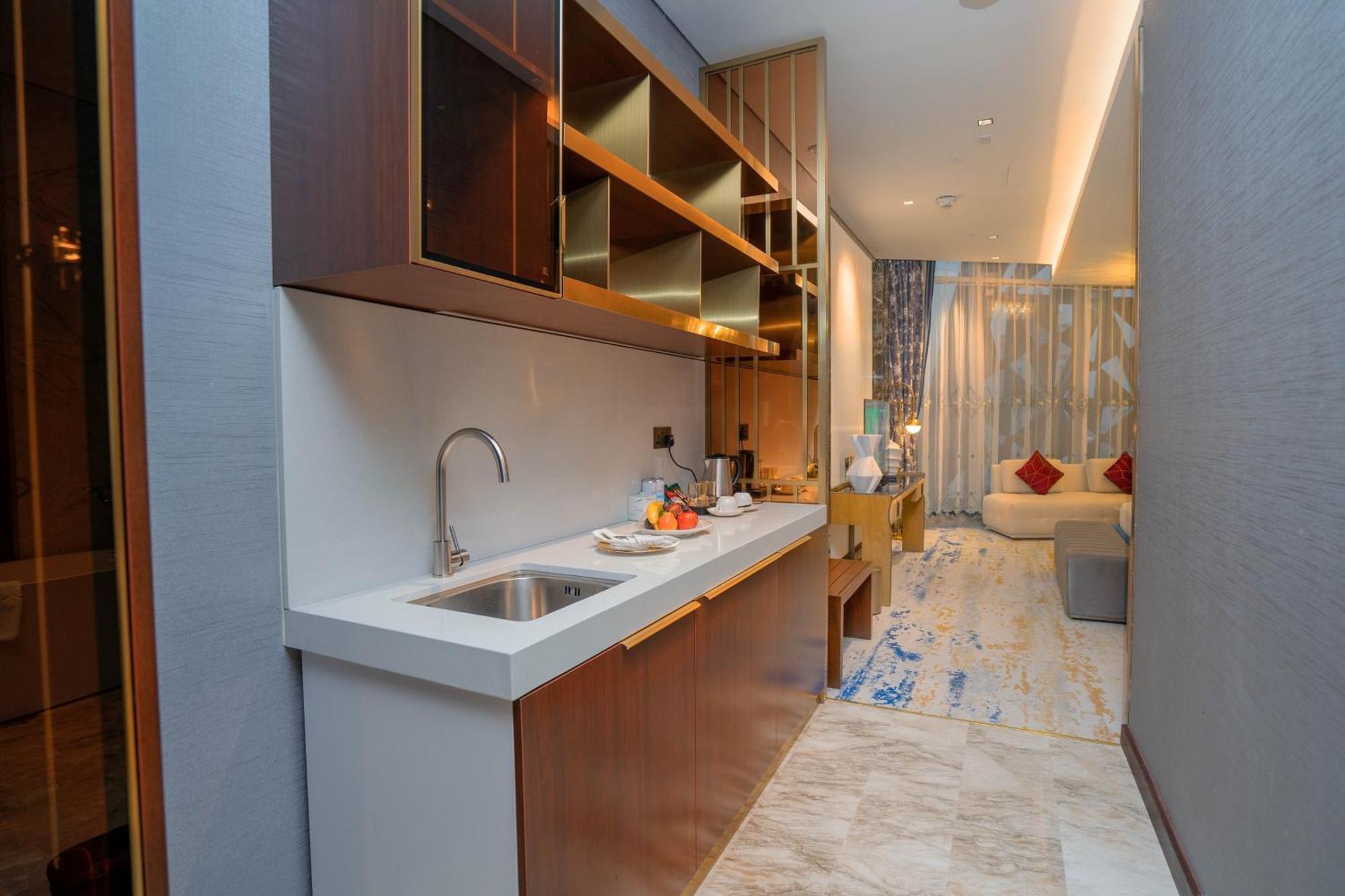 Velero Hotel Doha Lusail Экстерьер фото A kitchen in a hotel suite
